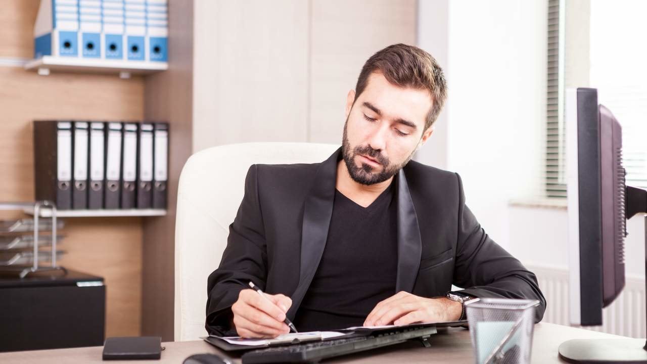 Businessman working at his office. Businessperson in professional environment